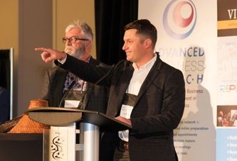McDougall Energy Participates in 2019 VIEA Business Match 175 Shows man at a podium pointing into the crowd