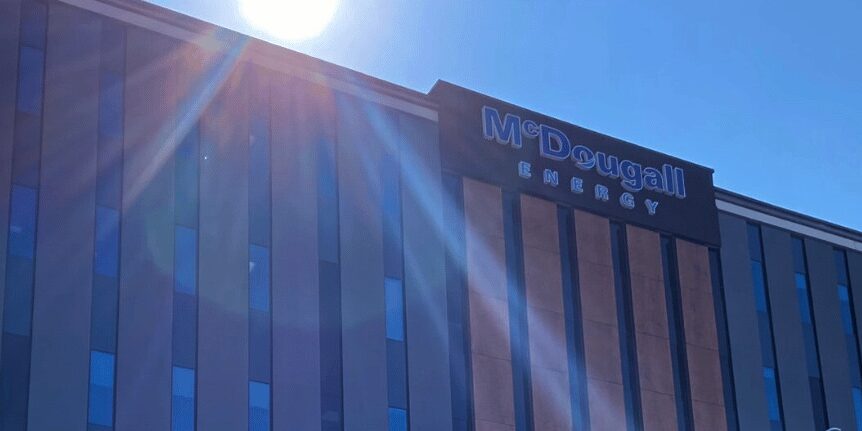 Sun shining on corporate building with many windows