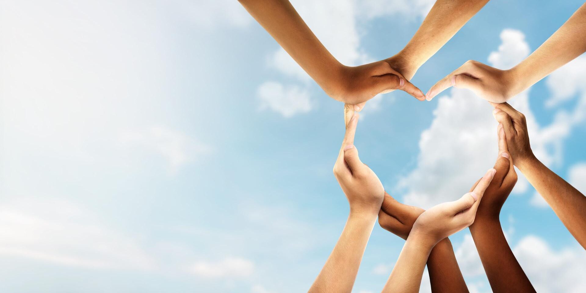 Unity and diversity are at the heart of a diverse group of people connected together as a supportive symbol that represents a sense of and togetherness. Symbol and shape created from hands.